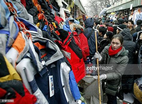 Shoppers, and Police, Flock to the Alley Looking for Fakes